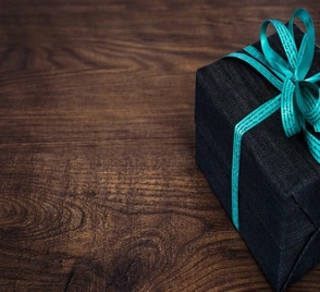 photo of a gift wrapped box on a table